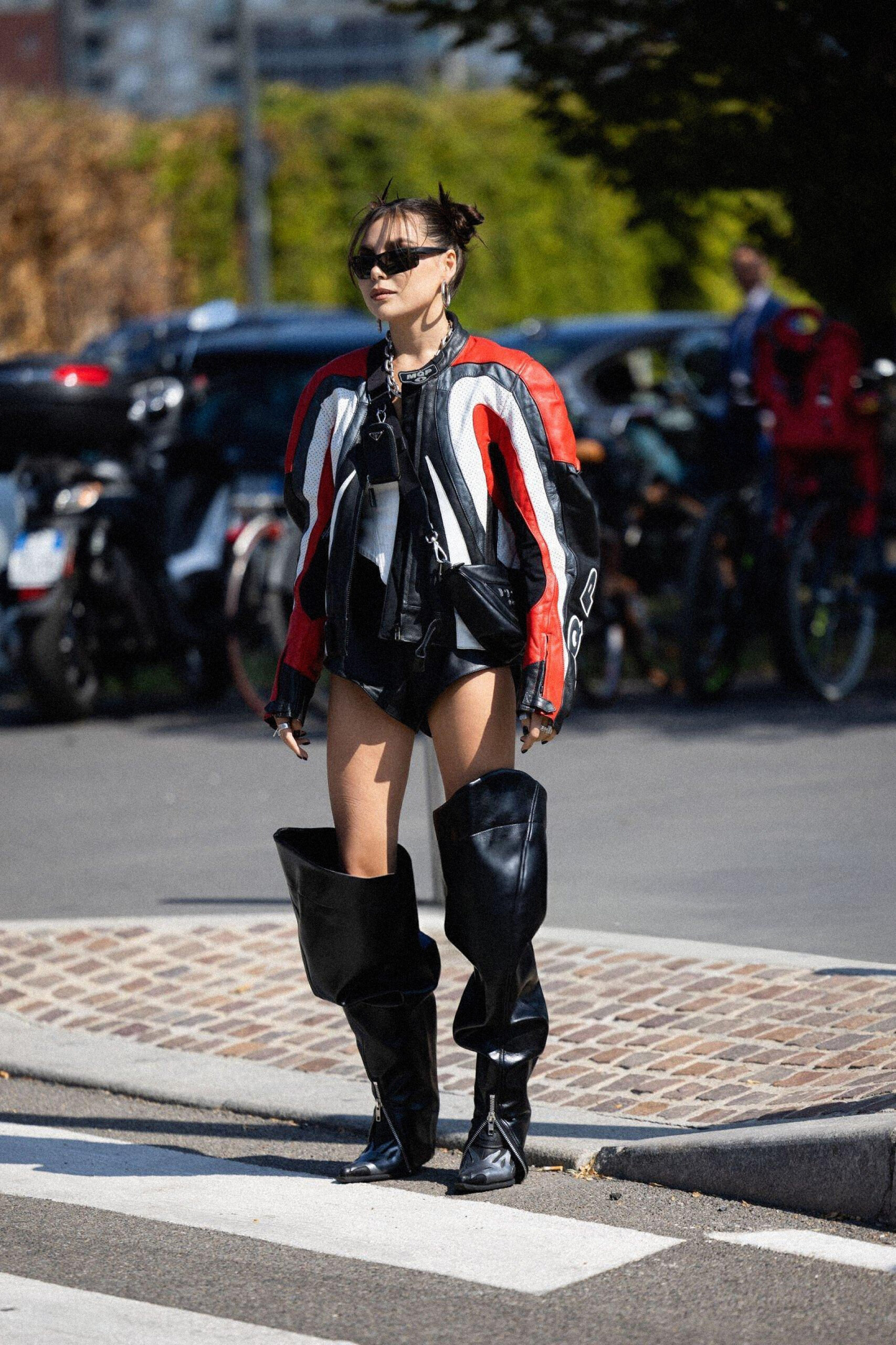 Karina Nigay is seen wearing a biker jacket, sunglasses, soft black boots, black shorts outside Prada show during the Milan Fashion Week - Womenswear Spring/Summer 2023 in 2022 in Milan, Italy. Photo by Valentina Frugiuele/Getty Images